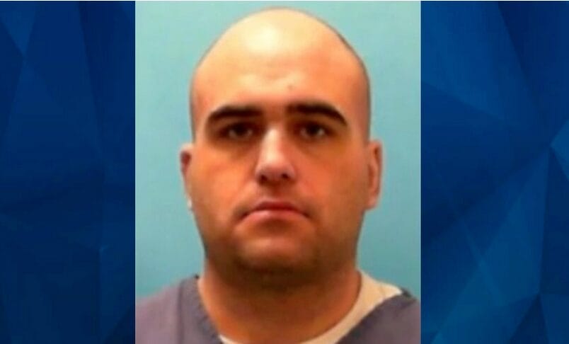 A man with a serious face.