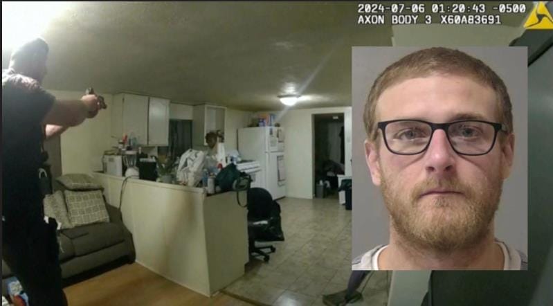 A police officer points a gun inside a cluttered kitchen. Inset shows a close-up of a man with glasses and a beard.